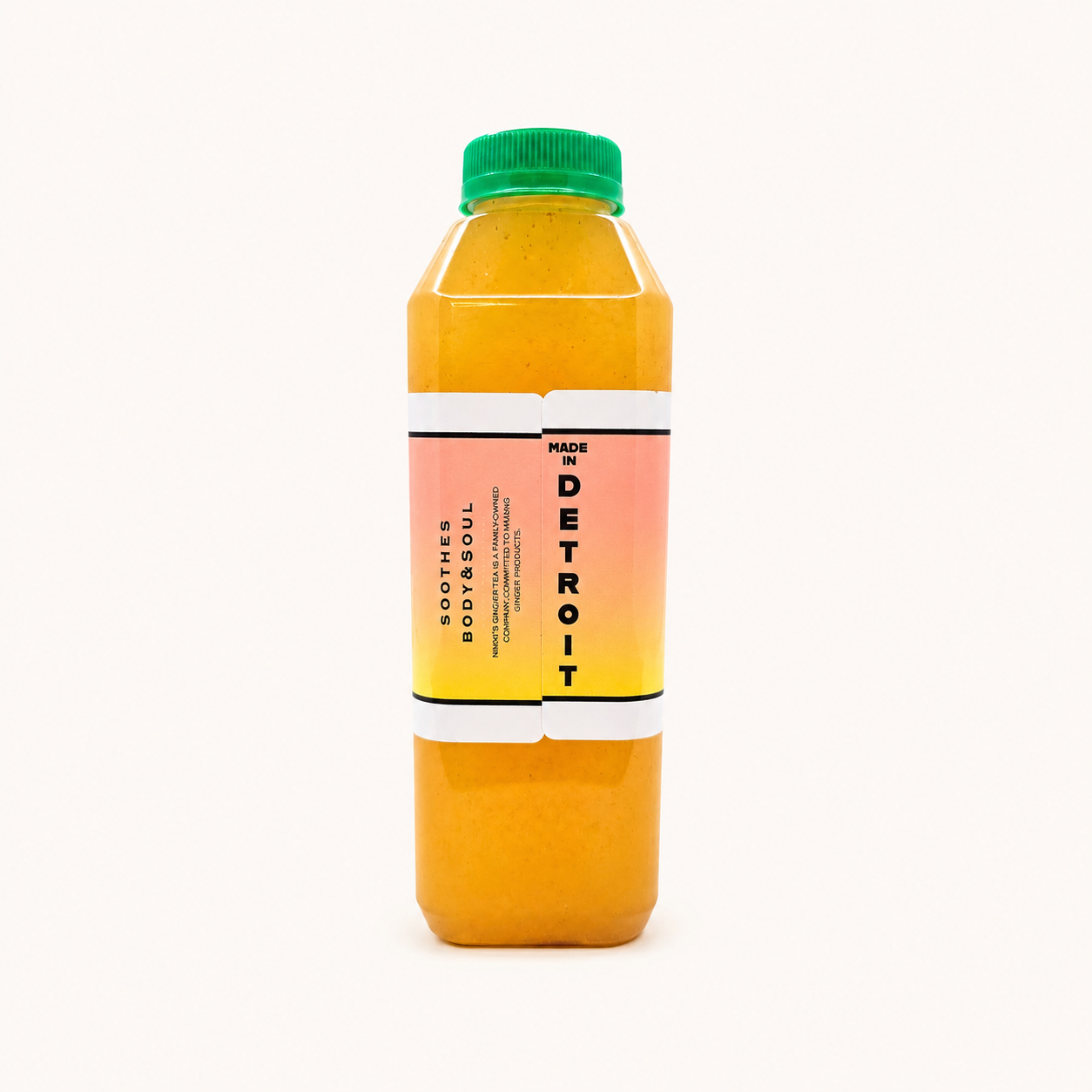 A bottle of Peach Ginger Lemonade, featuring a vibrant orange-yellow liquid inside a clear plastic bottle with a green cap and a pink-to-yellow gradient label.