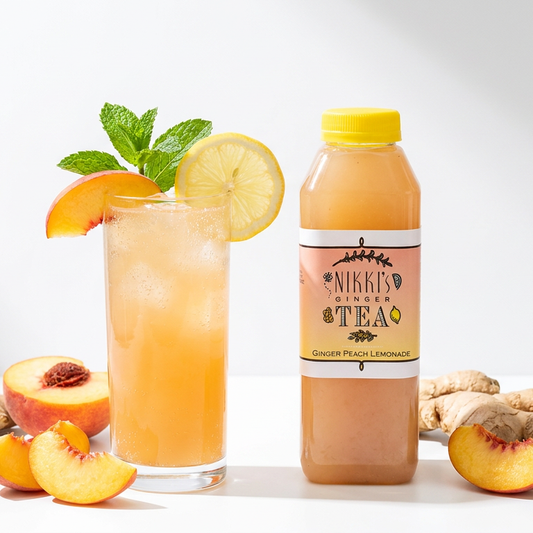 Peach ginger lemonade mocktail beside a Nikki's Ginger Peach Lemonade bottle