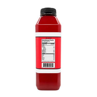 A red plastic juice bottle with a black cap, shown from the back with a white label displaying the nutritional facts panel.