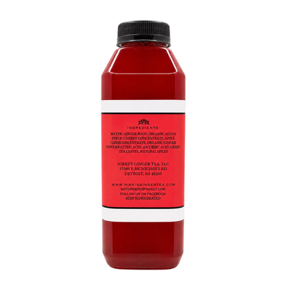 A bottle with a black cap and a red label, shown against a solid white background.