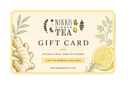 A rectangular Nikki's Ginger Tea gift card with rounded corners, featuring ginger root and lemon illustrations on a warm cream background with a pale yellow border.