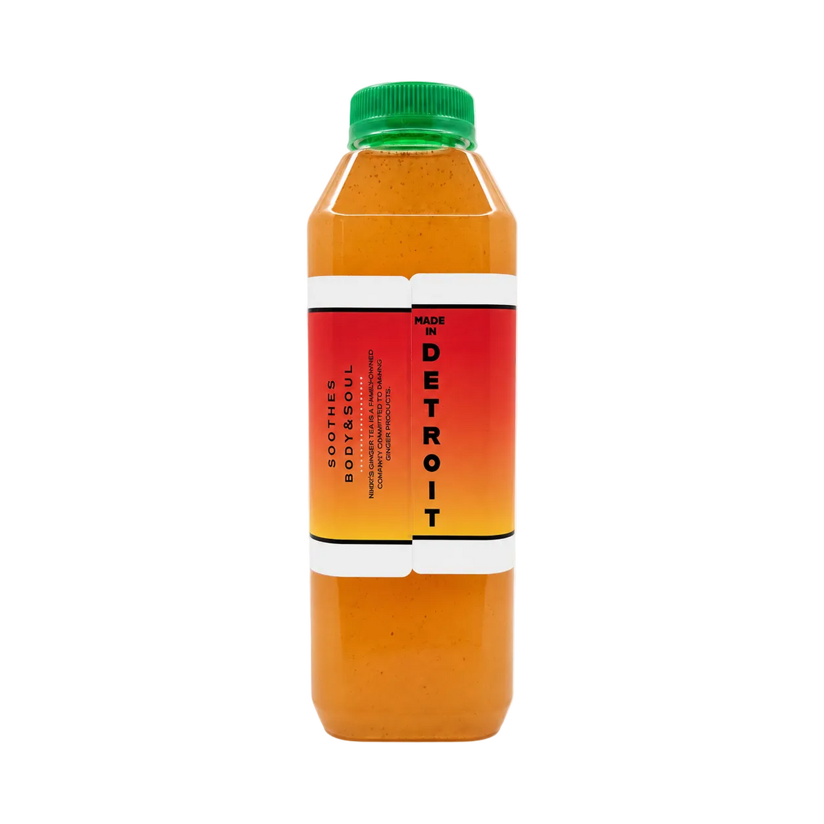 A bottle of amber colored lemonade, featuring an orange and red gradient label with a green cap, set against a plain off-white background.