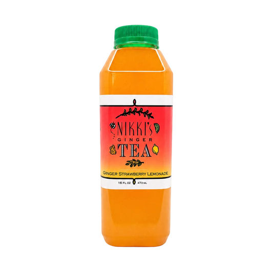 A bottle of Nikki's Ginger Tea in the Ginger Strawberry Lemonade flavor, filled with bright orange liquid and topped with a green cap, set against a plain white background.