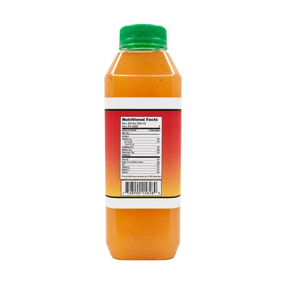 A plastic bottle of orange colored juice shown from the side, featuring a green cap and a red-to-orange gradient label with a white Nutrition Facts panel.