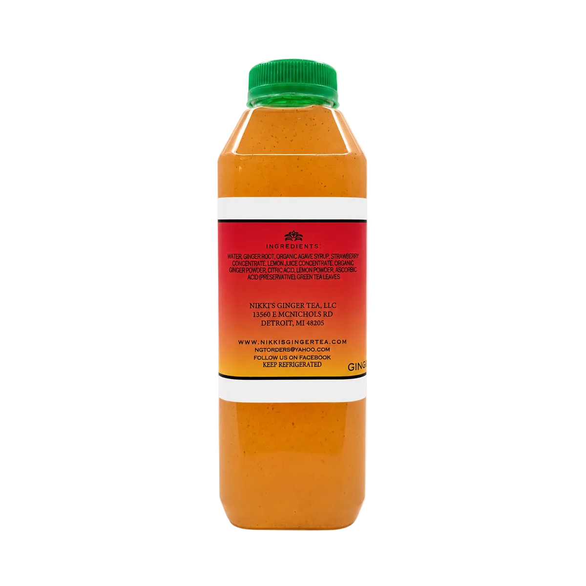 A bottle of ginger tea with a green cap, showing the back label against a plain white background.