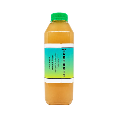 Side view of a Nikki's Ginger Tea Ginger Watermelon Lemonade bottle showing the "Made in Detroit" label text.