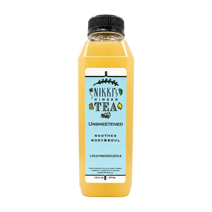 A bottle of Nikki's Ginger Tea Unsweetened cold pressed juice, filled with a golden yellow liquid, featuring a light blue label and a black cap, set against a plain white background.